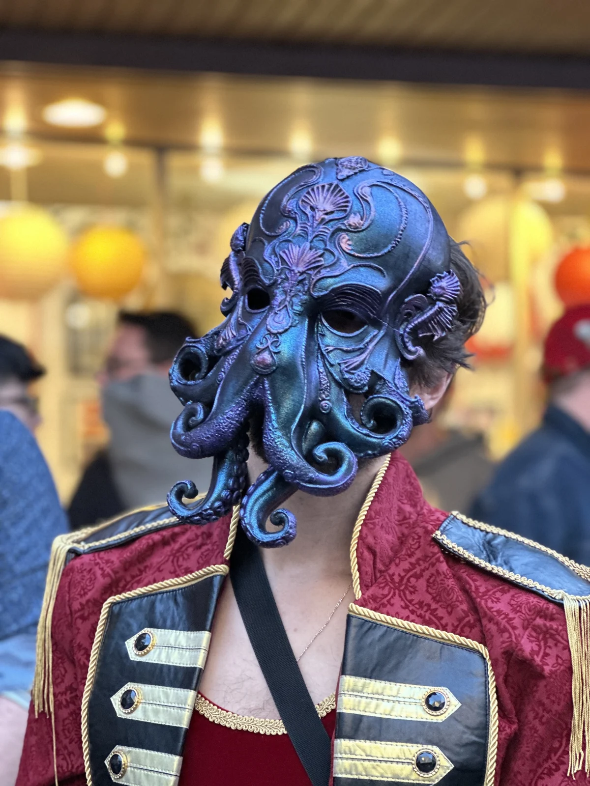 Iridescent blue and purple tentacled mask